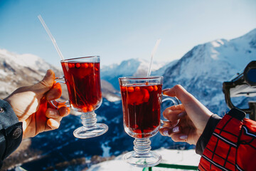 ea overlooking the mountains. Hot mulled wine in the ruach of tourists in the mountains.