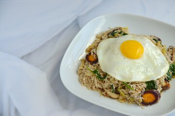 rice noodles with vegetables and sunny side up egg