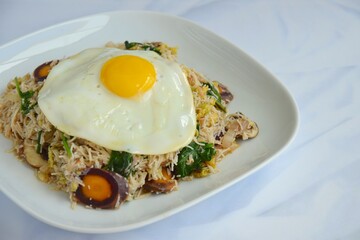 rice noodles with vegetables and sunny side up egg
