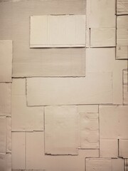 The old corrugated cardboard on the wall. Layer of brown packing and recycle paper. Scrap and patch of corrugated paperboard.
