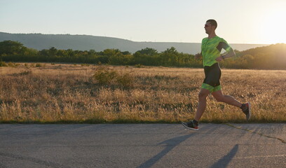 triathlon athlete running on morning trainig