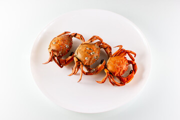 three crabs on a plate