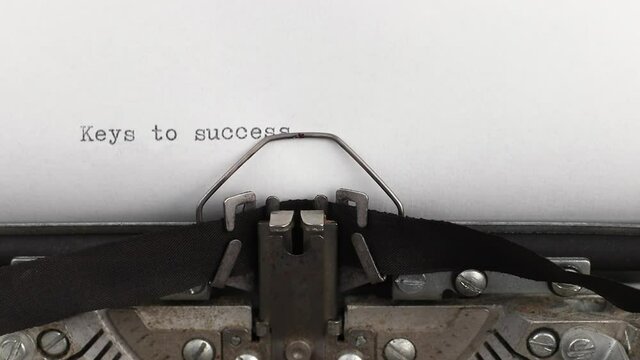 to type quote keys to success on a vintage and old typewriter close-up