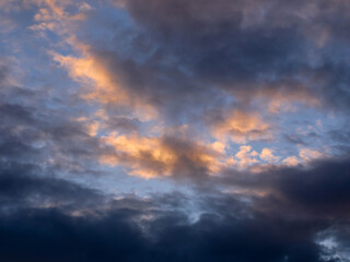 Dramatic sky with clouds at sunset. Cloudscape with sunlight.