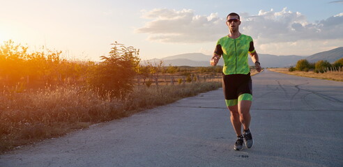 triathlon athlete running on morning trainig