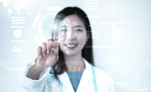 Smiling female doctor touches a virtual screen with data, icons and graphs