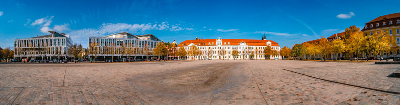 Panoramic view of major Dome square with fountains by Cathedral and Government Office in Magdeburg, Germany, at sunny day and blue sky during Golden Autumn.
