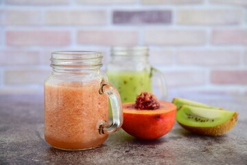Healthy peach kiwi smoothie in jars