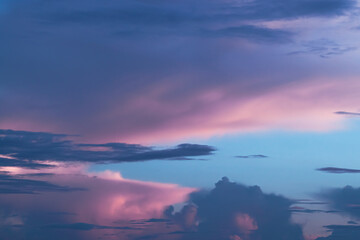 Fototapeta na wymiar Pink and blue sky with clouds like cotton candy for peaceful background or wallpaper