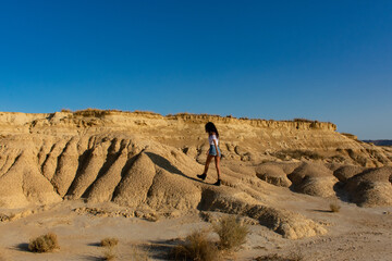 girl in the bardenas reales, desert of Navarra
