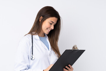 Teenager girl over isolated white background wearing a doctor gown and holding a folder