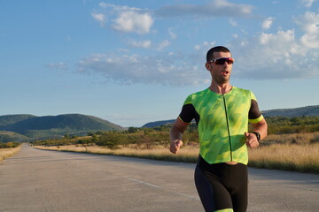 triathlon athlete running on morning trainig
