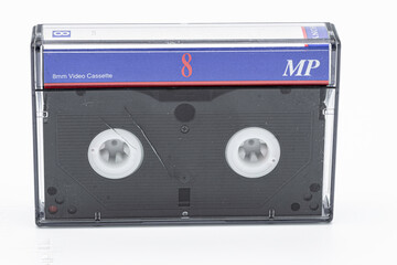 old 8mm magnetic tape on white background