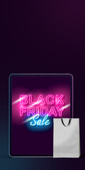 Device with lettering and shopping bag, black friday, sales concept. Flyer with copyspace. Cyber monday and online purchases, negative space for ad. Finance and money. Neon dark background.