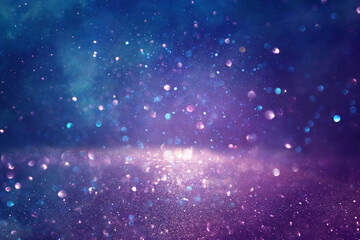 background of abstract glitter lights. gold, blue and purple. de focused
