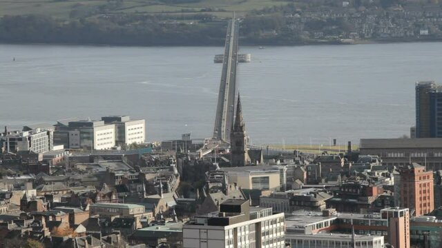 Elevated view of Dundee, Scotland, and the Tay Road Bridge.  Zooms out for wider view of city.