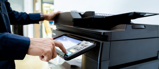 Bussiness man Hand press button on panel of printer, printer scanner laser office copy machine...