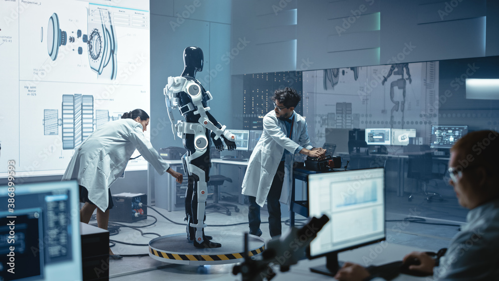 Poster in robotics development laboratory: chief female engineer and top male scientist work on a bionics e