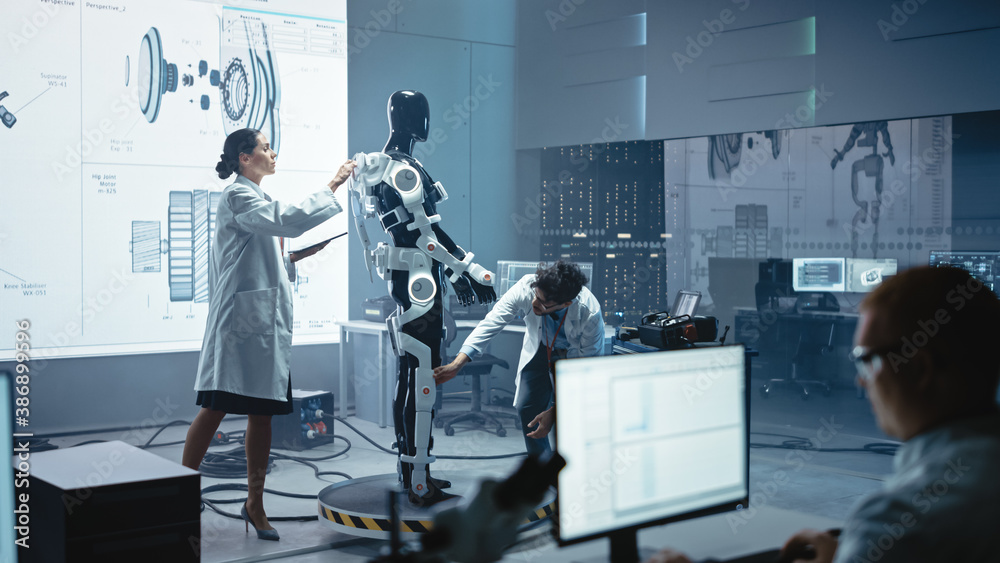 Leinwandbilder In Robotics Technology Development Laboratory Diverse Team of Engineers Work on a Bionics Exoskeleton Prototype. Scientists Design Powered Armor Suit to Help Disabled People and Hard Labor Workers