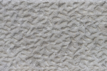 Rough uneven surface of the plastered wall.