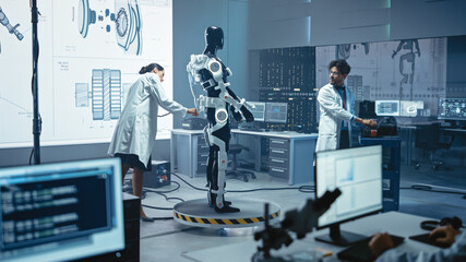 In Robotics Technology Development Laboratory Diverse Team of Engineers Work on a Bionics...