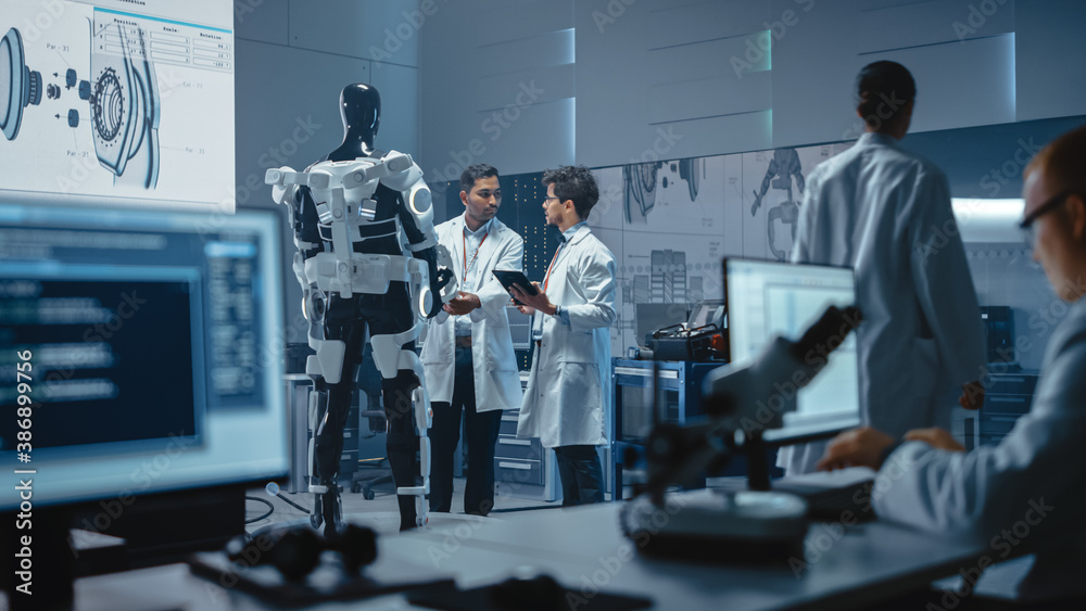 Leinwandbilder In Robotics Development Laboratory International Team of Engineers and Scientists Work on Robotics Exoskeleton Prototype. Designing Powered Exosuit to Help Disabled People Walk, Workers to Lift Goods