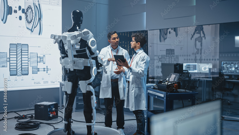 Leinwandbilder In Robotics Development Laboratory International Team of Engineers and Scientists Work on Robotics Exoskeleton Prototype. Designing Powered Exosuit to Help Disabled People Walk, Workers to Lift Goods