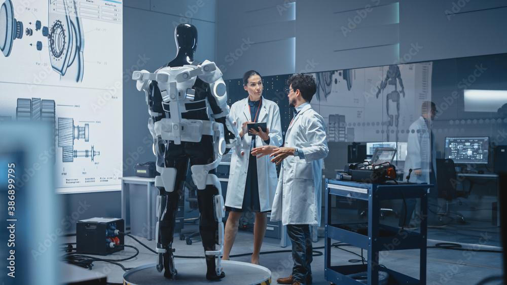 Leinwandbilder In Robotics Development: International Team of Engineers and Scientists Work on Robotics Exoskeleton Prototype. Designing Powered Exosuit to Help Disabled People Walk Hard Labor Workers to Lift Goods