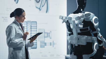 In Robotics Development Laboratory: Chief Female Engineer Works on Bionics Exoskeleton Prototype....