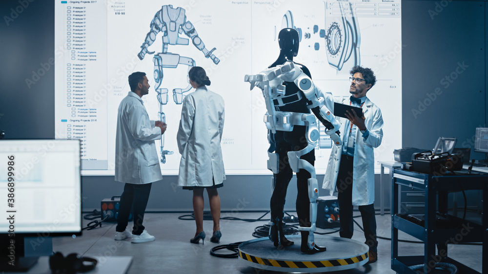 Leinwandbilder in robotics development laboratory: female engineer and male scientist work with big screen showing 