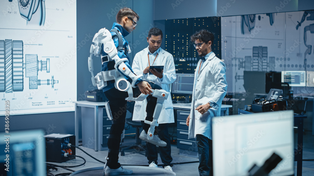 Leinwandbilder in robotics development laboratory: engineers and scientists work on a bionics exoskeleton prototype