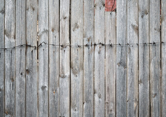 old wooden fence with barbed wire