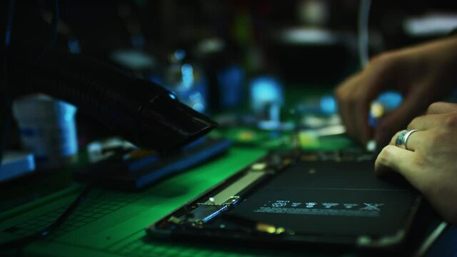 Smartphone is being repaired in a workshop