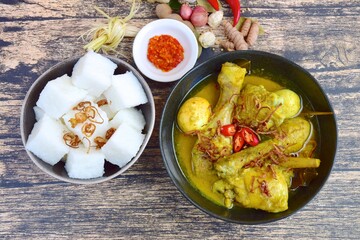 Opor ayam, chicken cooked in coconut milk from Indonesia, from Central Java, added with boiled...