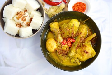 Opor ayam, chicken cooked in coconut milk from Indonesia, from Central Java, added with boiled...