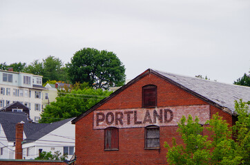 Romantic backstreet, side street or alley in historic old town of Portland, Maine with New England...