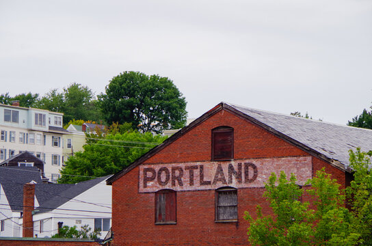 Romantic backstreet, side street or alley in historic old town of Portland, Maine with New England Victorian style architecture facades, a landmark sightseeing tourist spot in old town