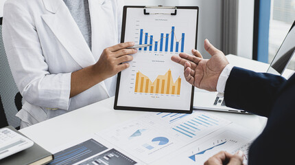 Job meeting between a business woman boss and a male finance worker.
