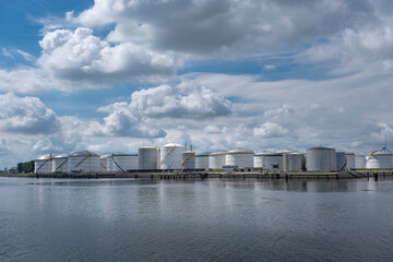 Fototapeta premium Port of Rotterdam. Botlek. Oil refinery plant from industry zone, oil and gas industrial, Refinery factory oil storage tank and pipeline steel