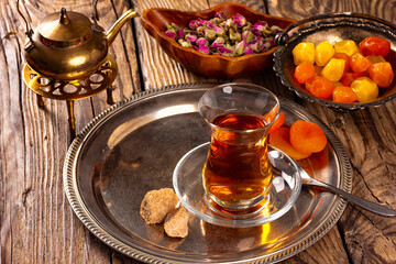 Turkish delight sweets on plate with Turkish tea.