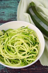 Zoodles (zucchini noodles) in a bowl. Spiralized zucchini