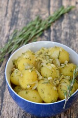Boiled potato with onion, garlic and rosemary