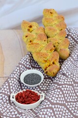 Fresh baked French pain d'epi or wheat stalk bread with goji berry and poppy seeds
