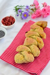 Fresh baked French pain d'epi or wheat stalk bread with goji berry and poppy seeds
