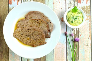 Grilled black pepper minute steak with basil butter 