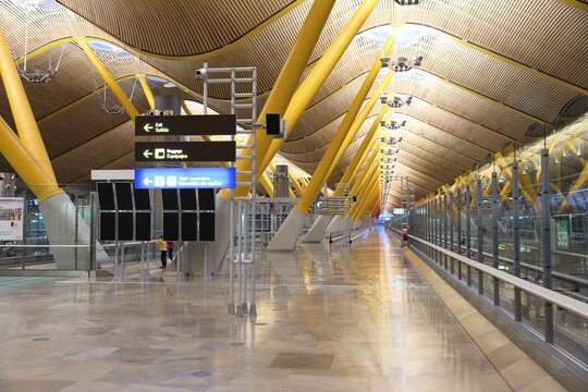 MADRID, SPAIN - DECEMBER 6, 2016: People wait at Terminal T4 Madrid Barajas Airport in Spain. It is the 6th busiest airport in Europe, with 50.4 million passengers in 2016. It is managed by AENA.