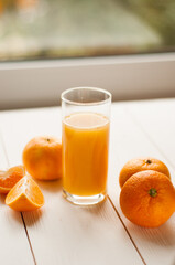 Glass of 100% Orange juice with pulp and sliced fruits isolate on white background.Be cut to remove the orange juice to drink and eat and be healthy.