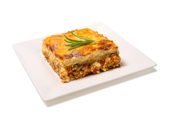 Greek Moussaka close up on a square plate isolated on white background.