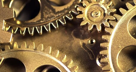 Close Up Old Golden Gears Turning in Working Mechanism 