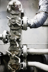 Old aged gray pipes and valves